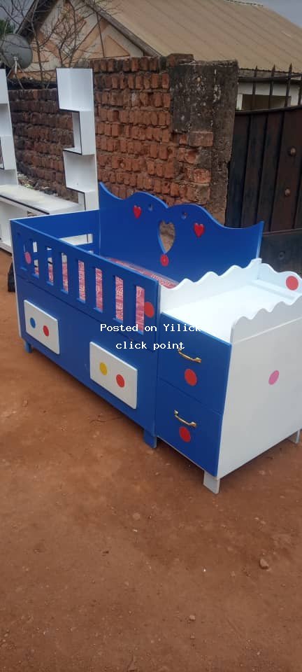 Colorful Baby Cot with Changing Table - Perfect for Your Little One for sale in Kampala - Yilick
