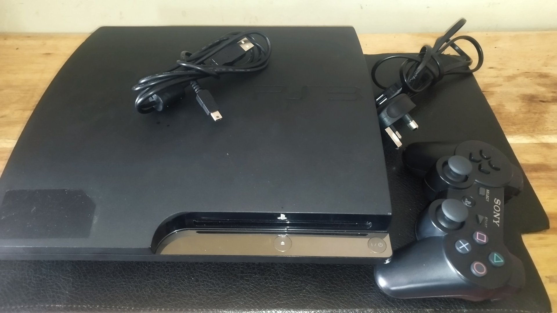 Sony PlayStation 3 Console with Controller and Cables for sale in Kampala - Yilick